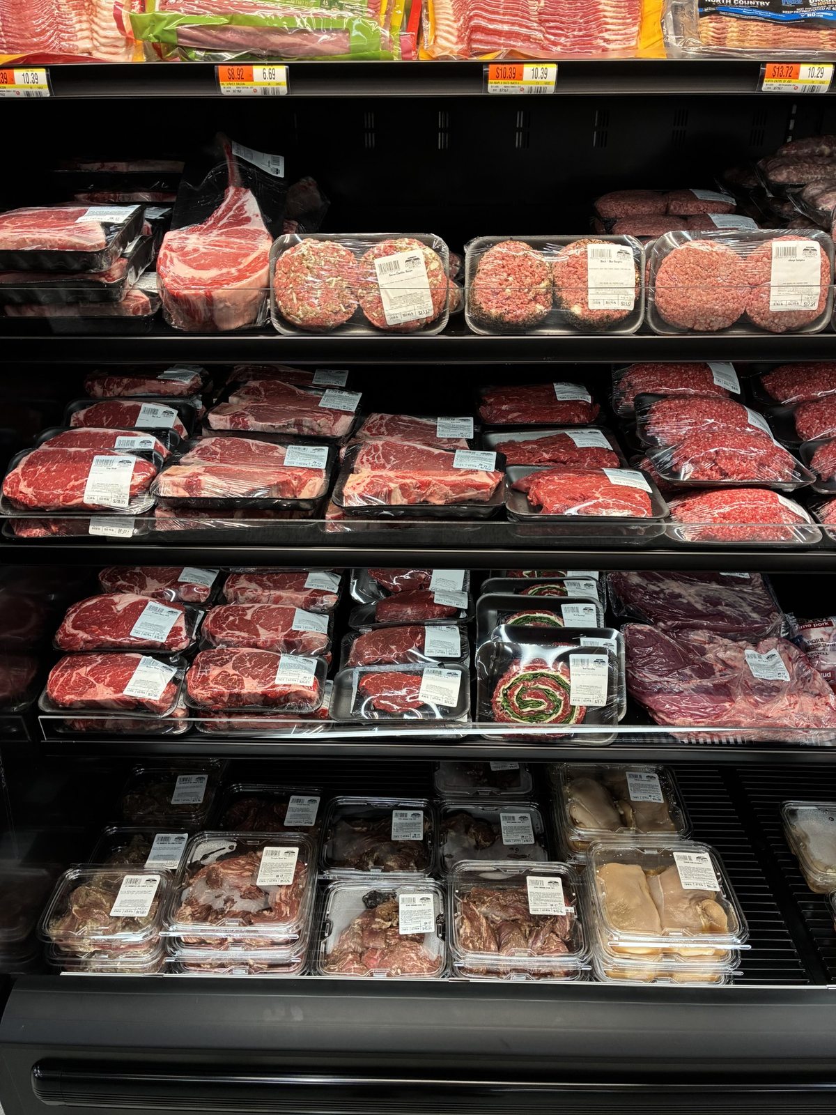 Fresh steaks, burgers, roasts, and prepared cuts in the butcher case