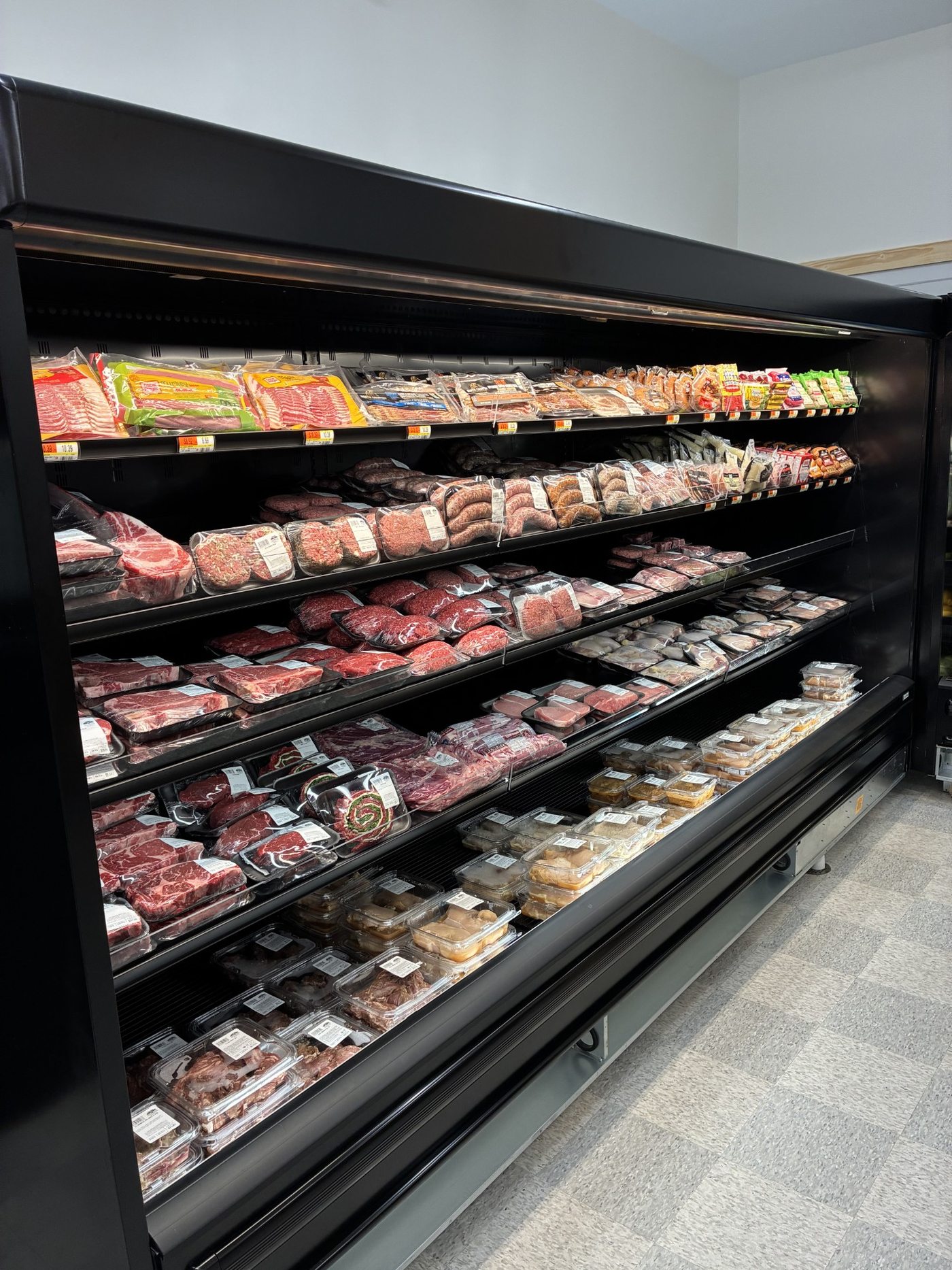 The stocked fresh meat case at Chichester Market
