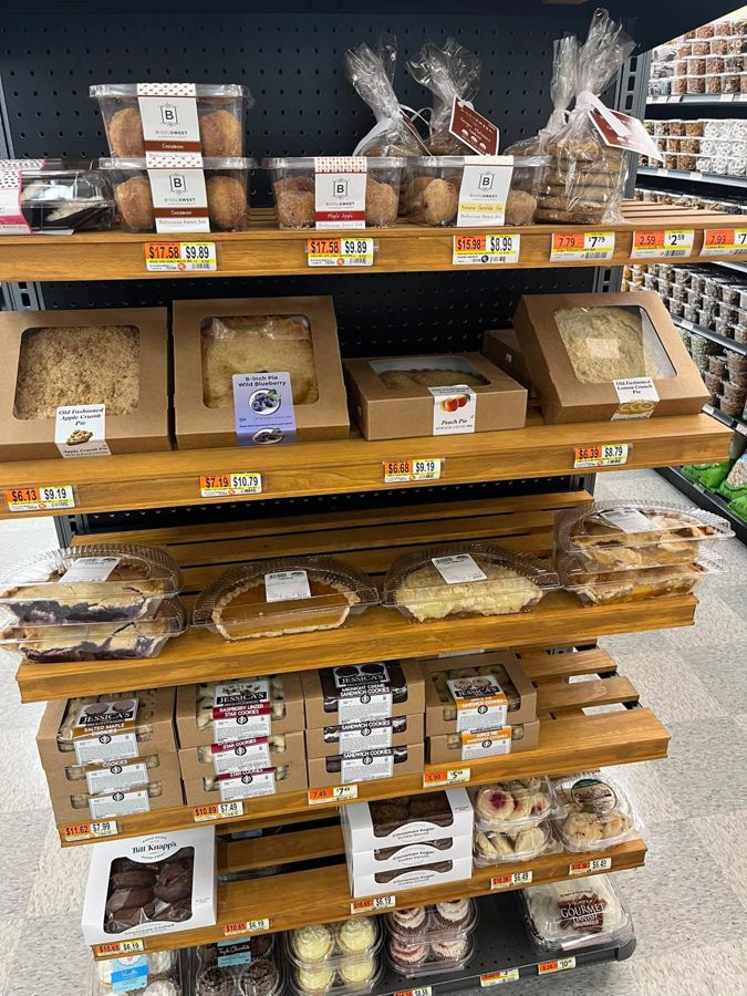 Bakery shelves with pies, cookies, doughnut muffins and pastries