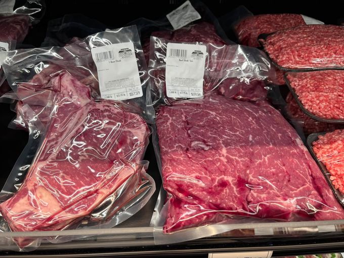 Vacuum-packed beef and ground beef in the meat case
