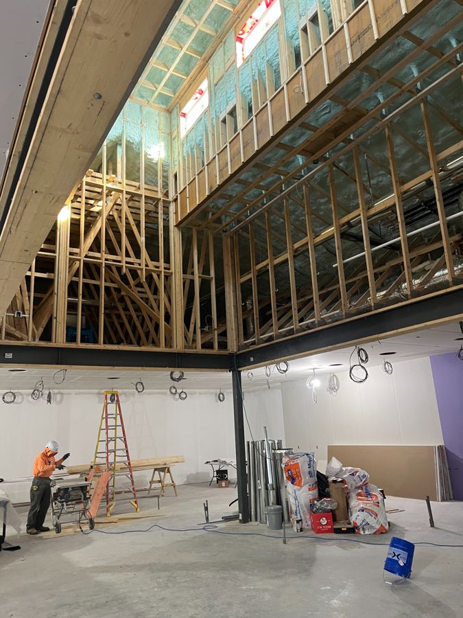 Exposed interior framing, insulation and drywall during construction