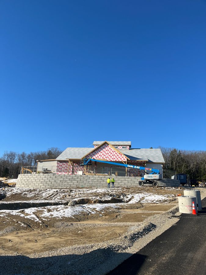 The market exterior with unfinished siding and roof