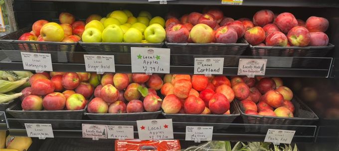 Apples with signs naming Surowiec Farm and Meadow Ledge Farm