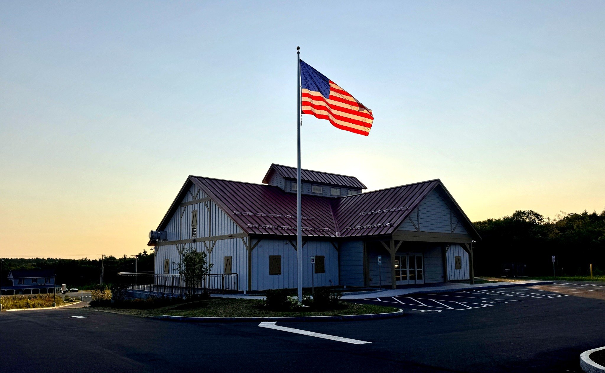 Chichester Market at sunrise with the American flag flying in front
