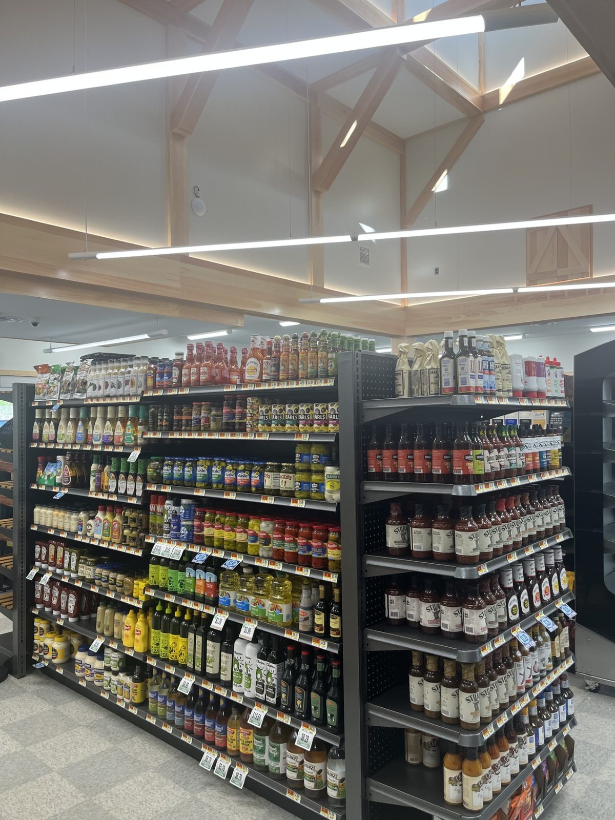 Well-stocked grocery aisles inside Chichester Market