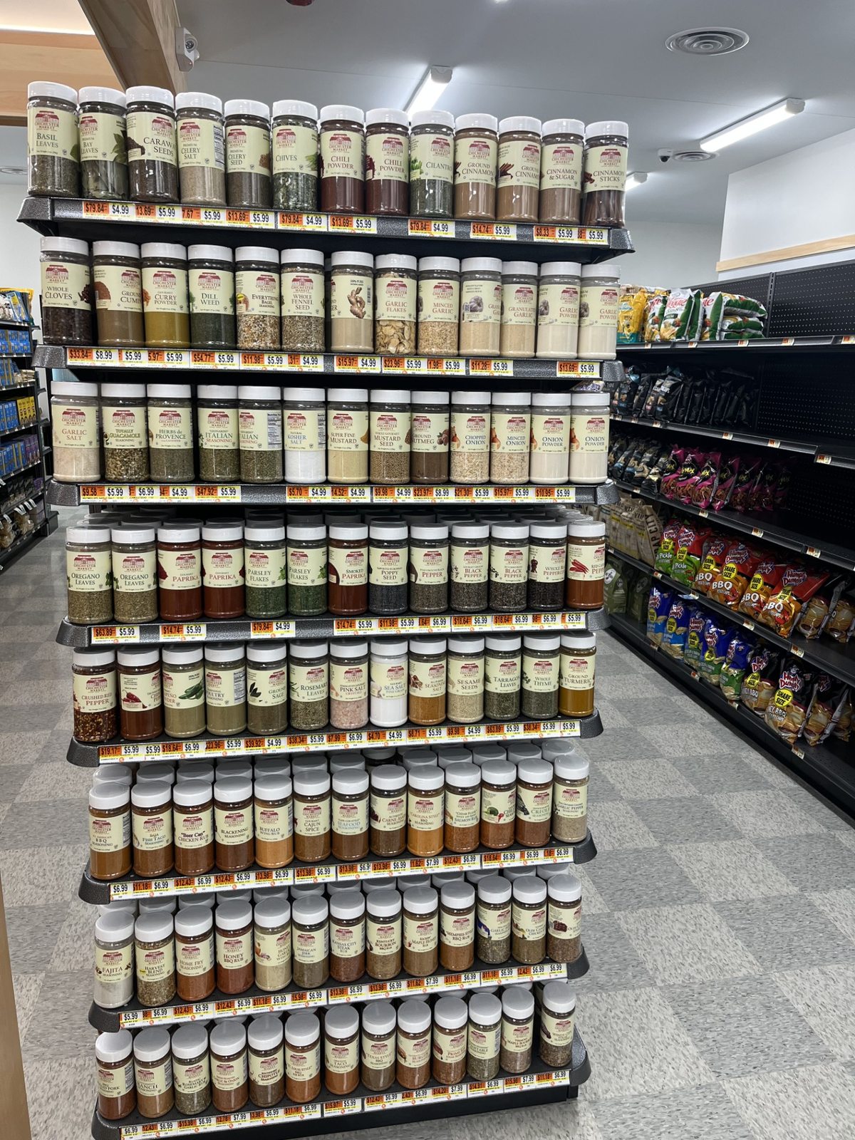 A large display of spices and seasonings at Chichester Market